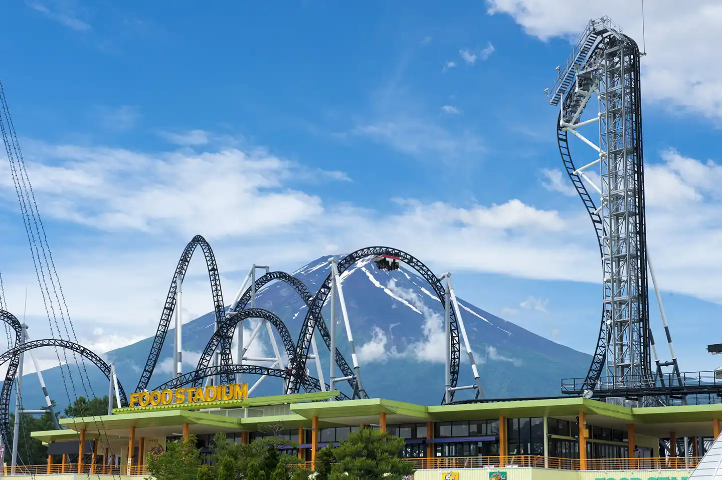 Fuji-Q Highland NARUTO x BORUTO Fuji Hidden Leaf Village with Mount Fuji behind — the official Naruto theme park in Yamanashi, home of the Valley of the End MX4D VR experience