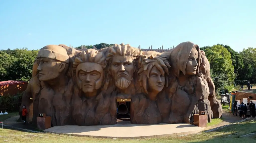 Nijigen no Mori NARUTO & BORUTO Shinobi Village at night on Awaji Island — Hokage Rock lit by projection mapping, the largest dedicated Naruto attraction in the world