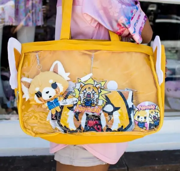 Ita-bag otaku fashion — transparent bag decorated with anime pins charms and figures
