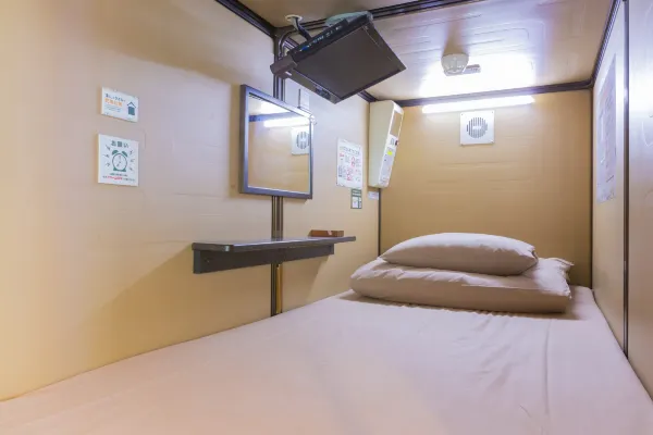Square capsule design at Anshin Oyado Akihabara with TV and amenities