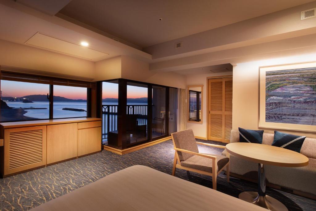 AoAwo Naruto Resort — ocean-view guest room with balcony overlooking the Naruto Strait and the Great Naruto Bridge.
