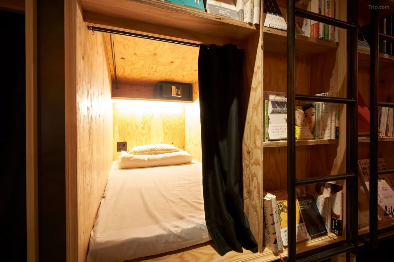 Beds tucked inside bookshelves
