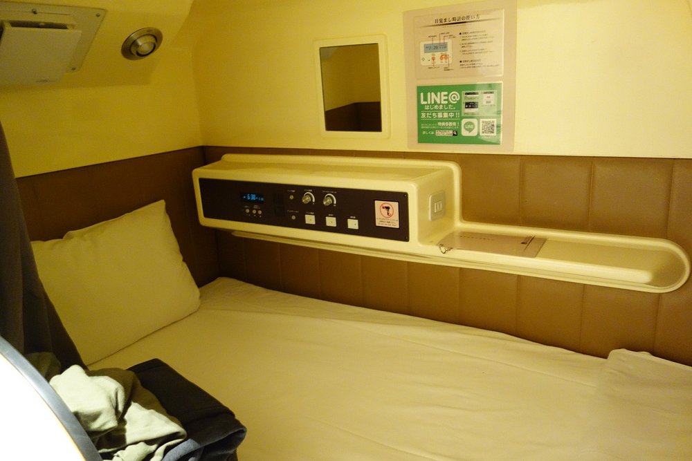 Grancustoma Ueno - High-tech sleeping pod with full electronic controls, Tokyo capsule hotel.