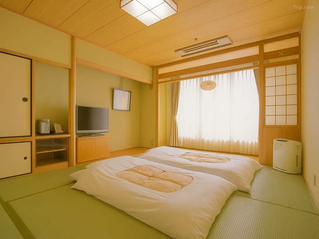 Dogo Onsen Honkan at night — Spirited Away bathhouse