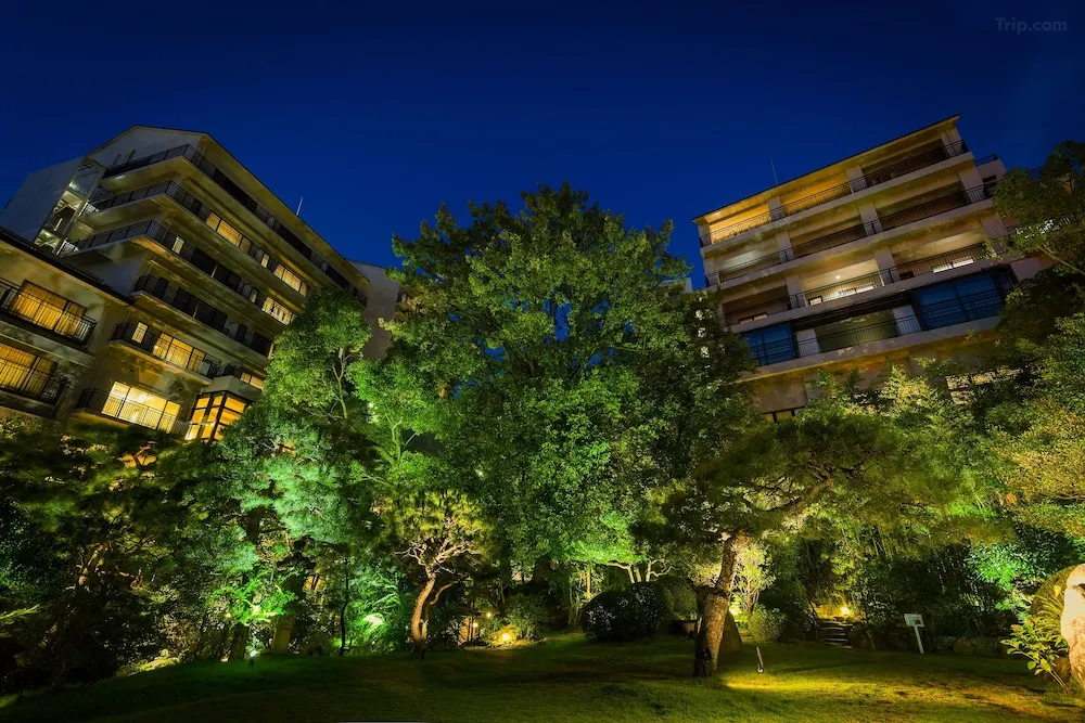 Dogo Onsen Funaya ryokan exterior, Matsuyama Ehime — entrance and garden at dusk