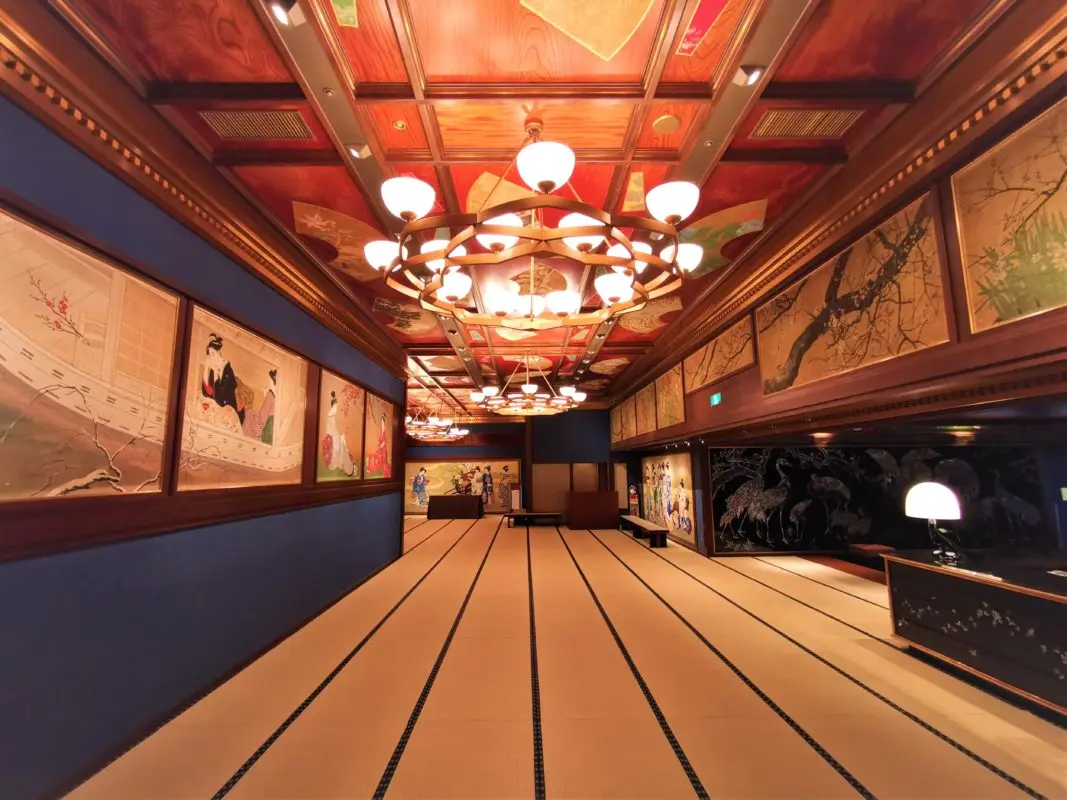 Decorated corridor and carved wooden panels inside Hotel Gajoen Tokyo historic building