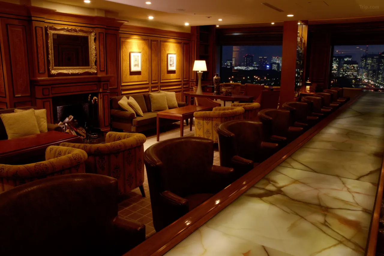 Imperial Hotel Tokyo — The Old Imperial Bar; A sophisticated lounge featuring salvaged Oya stone tiles from Frank Lloyd Wright's 1923 building, offering stunning city views and an inviting atmosphere for evening drinks. Experience historic luxury at this landmark Tokyo hotel