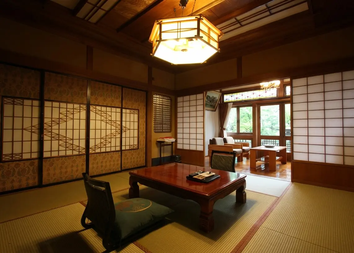 Kanaguya Saigetsuro illuminated gold at night — cobblestone street of Shibu Onsen, Nagano