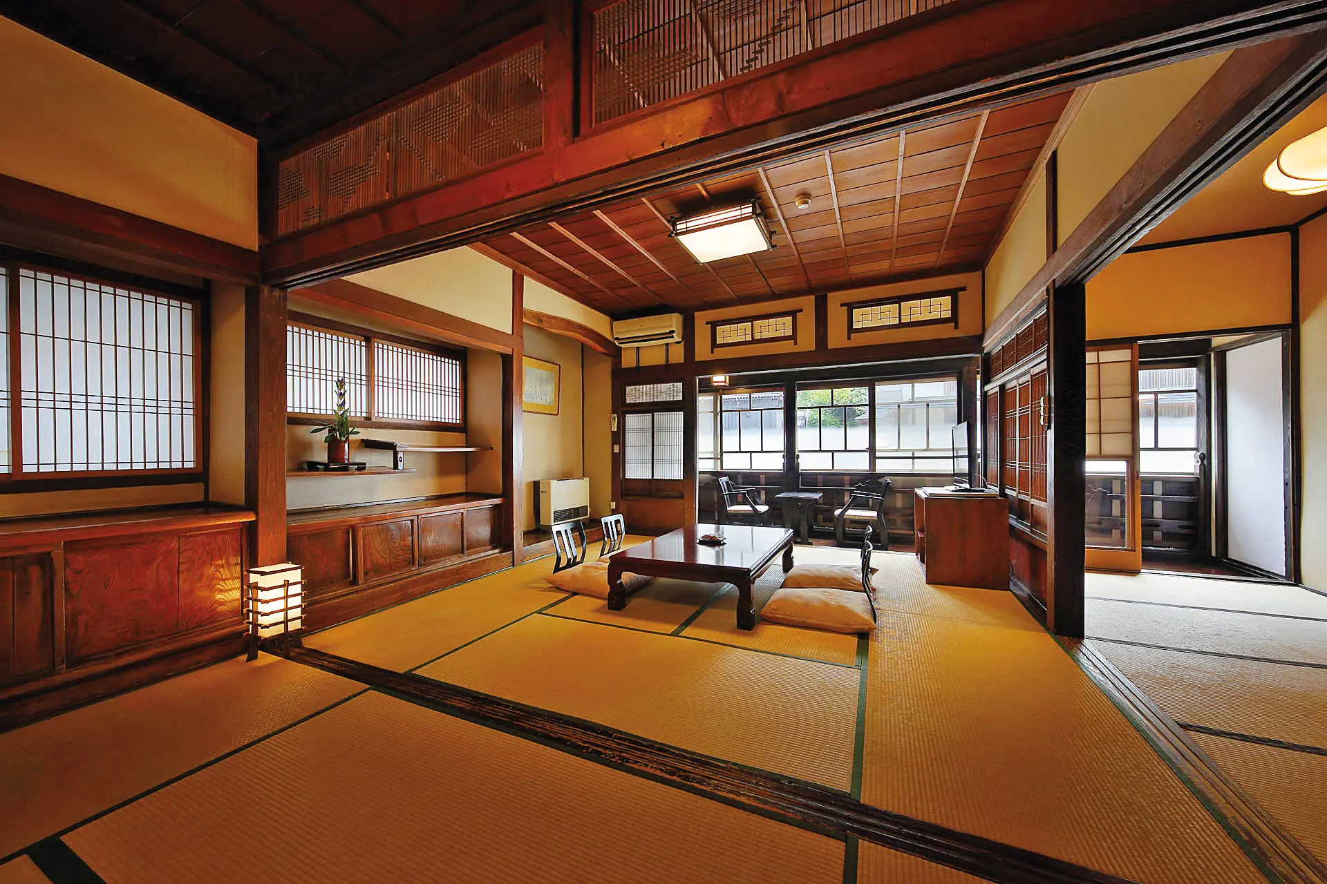 Notoya Ryokan interior — Taisho-era amber wooden staircase, traditional design details and period craftsmanship inside the national cultural property