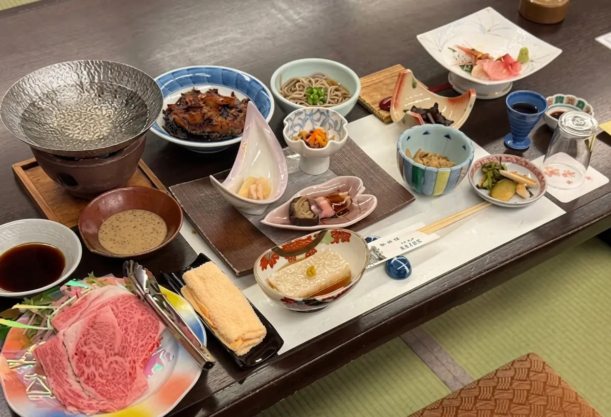 Tatami guest room at Notoya Ryokan — Taisho-era interior with river view, traditional Japanese room Ginzan Onsen