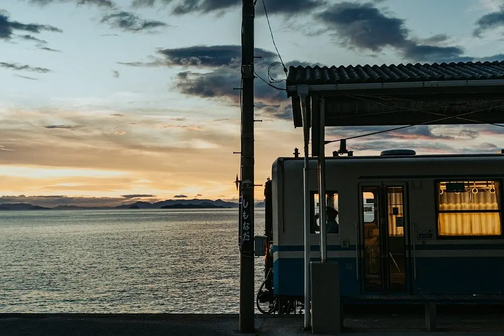 JR Yosan Iyonada Line coastal train at Iyo-Kaminada Station — one stop from Shimonada the Spirited Away sea railway location Ehime