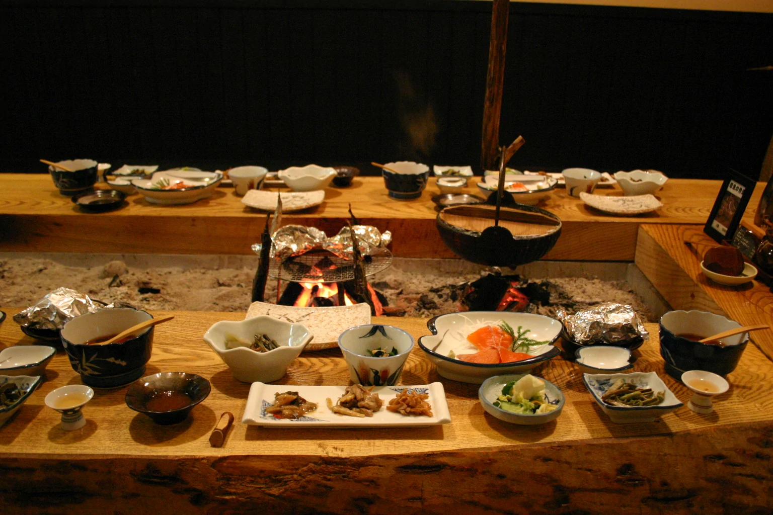 Irori hearth room at Sankosou — tatami room with recessed floor hearth and mountain view