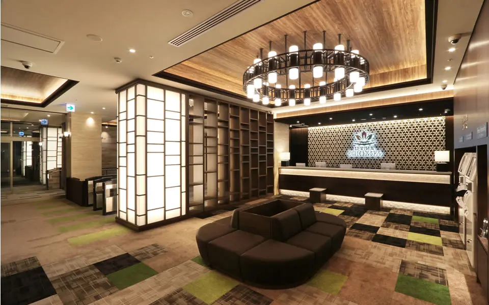 Teriha Spa Resort 照葉スパリゾート — elegant modern lobby and reception desk featuring traditional Japanese design elements in Higashi-ku, Fukuoka. | Hotel Manga